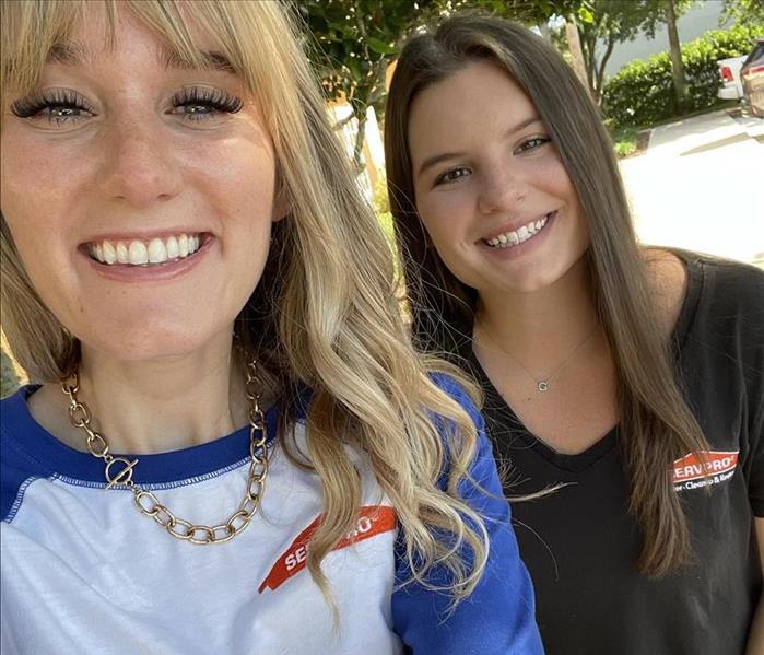 picture of marketing smiling at the camera. its a selfie of 2 girls