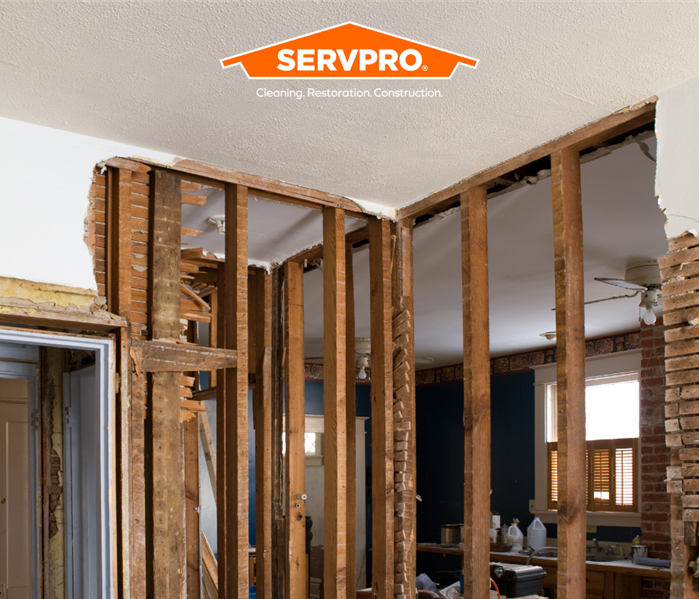 house framing that needs drywall with SERVPRO logo